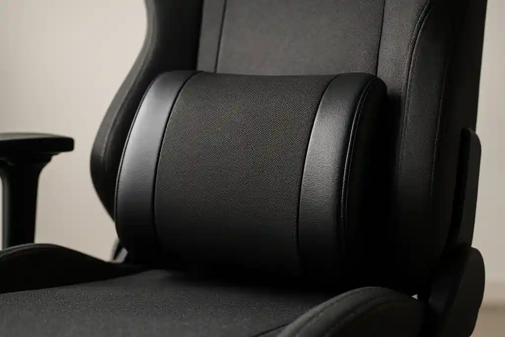 Editorial photograph of a gaming chair's lumbar support cushion shown up close