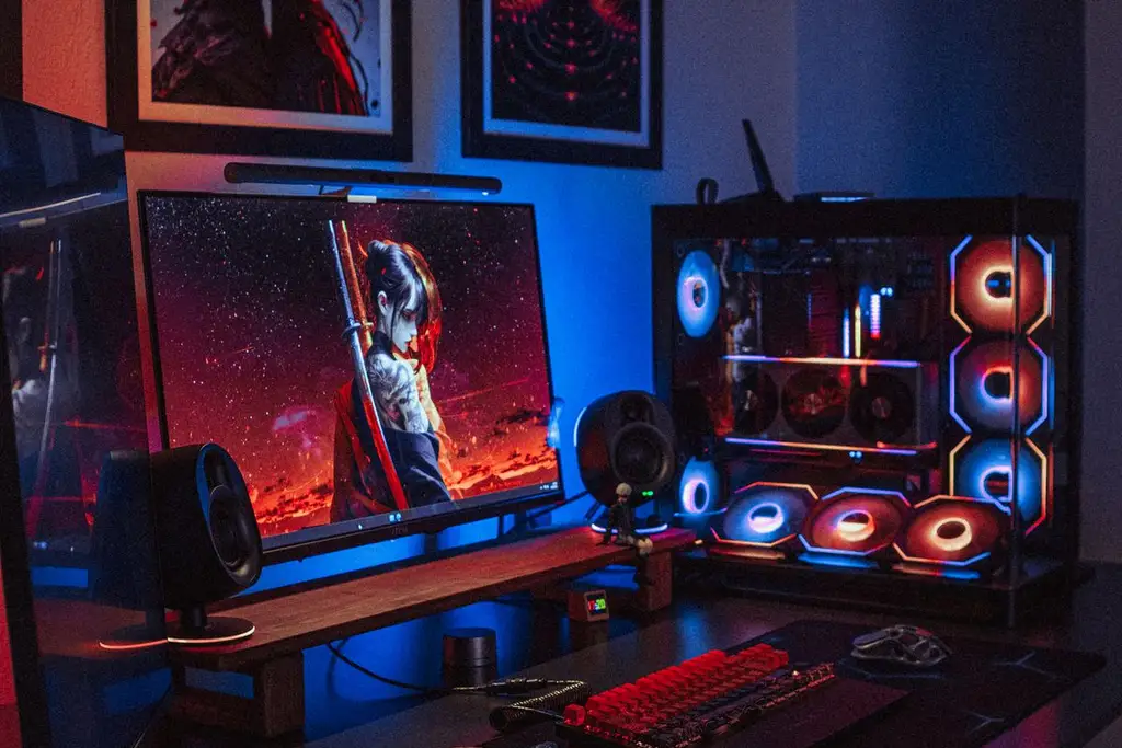 A dual monitor RGB gaming setup with a custom PC